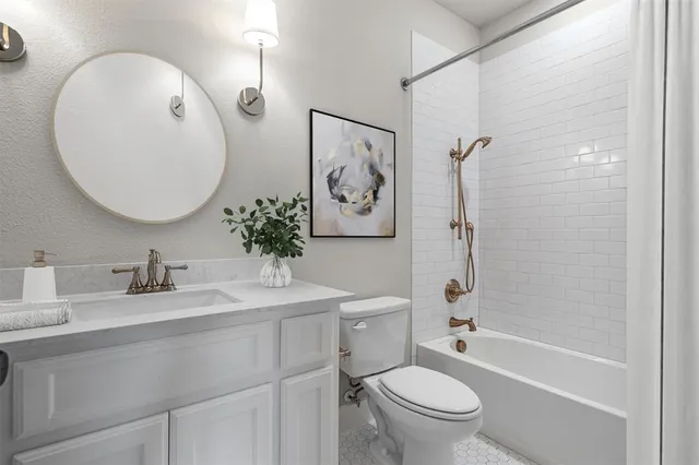 a bathroom with a toilet a sink and a mirror