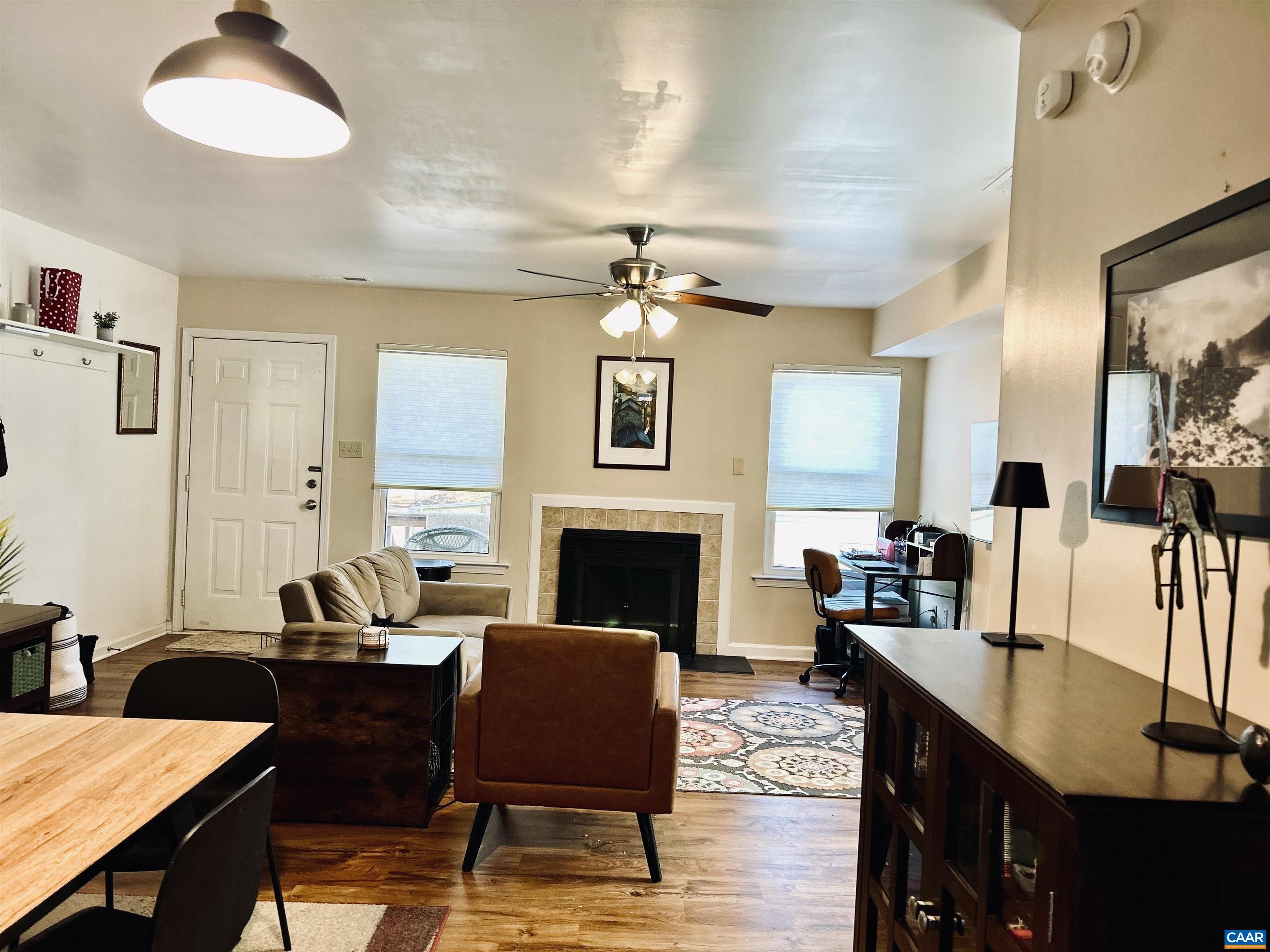 340 Riverside Avenue Charlottesville, VA 22902 - Photo 2 of 17 a living room with furniture a fireplace and next to a window