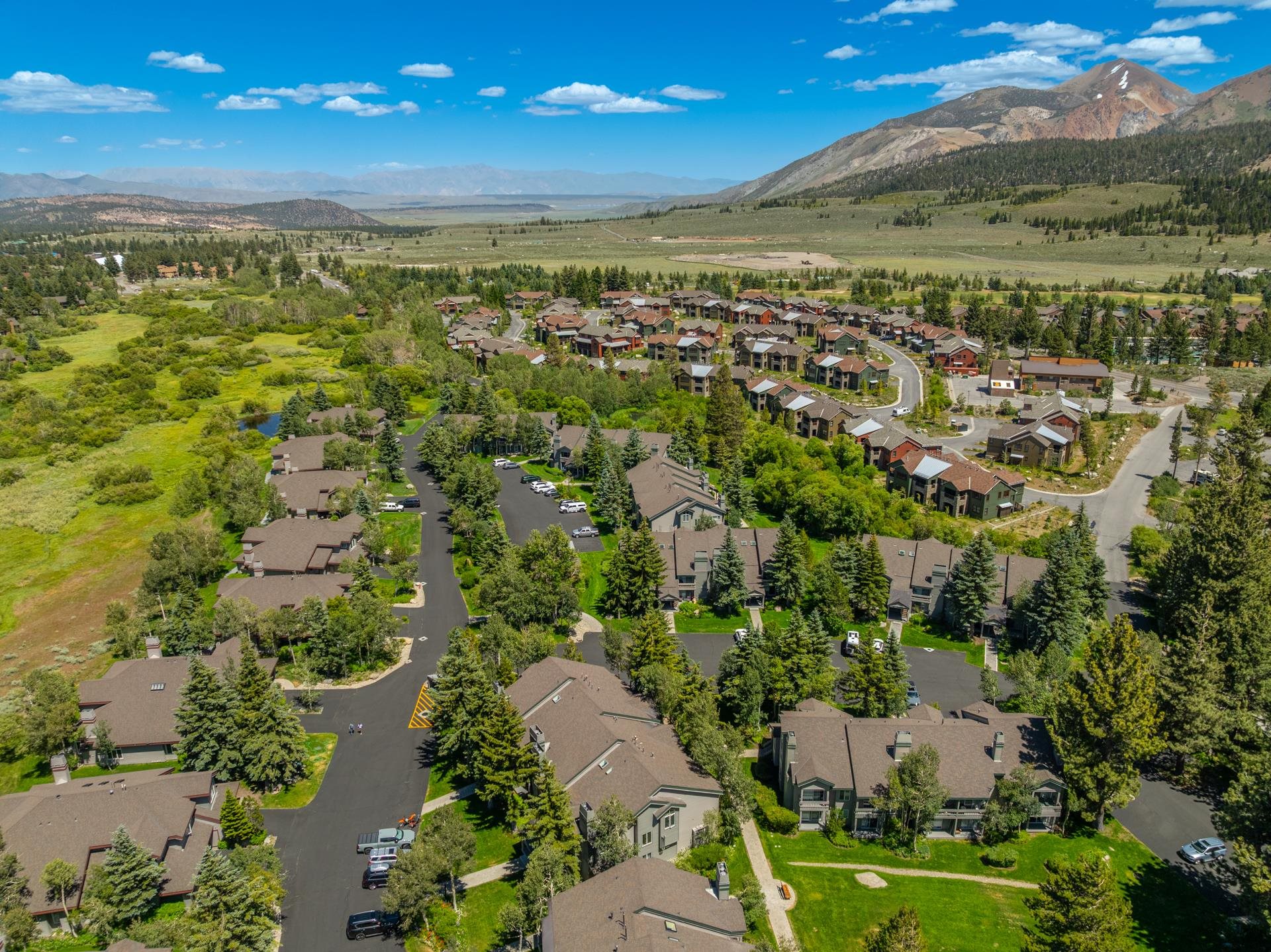 609 Golden Creek Road, Unit 609 Mammoth Lakes, CA 93546 - Photo 40 of 42 Aerial perspective showcasing a residential community nestled within a mountainous landscape