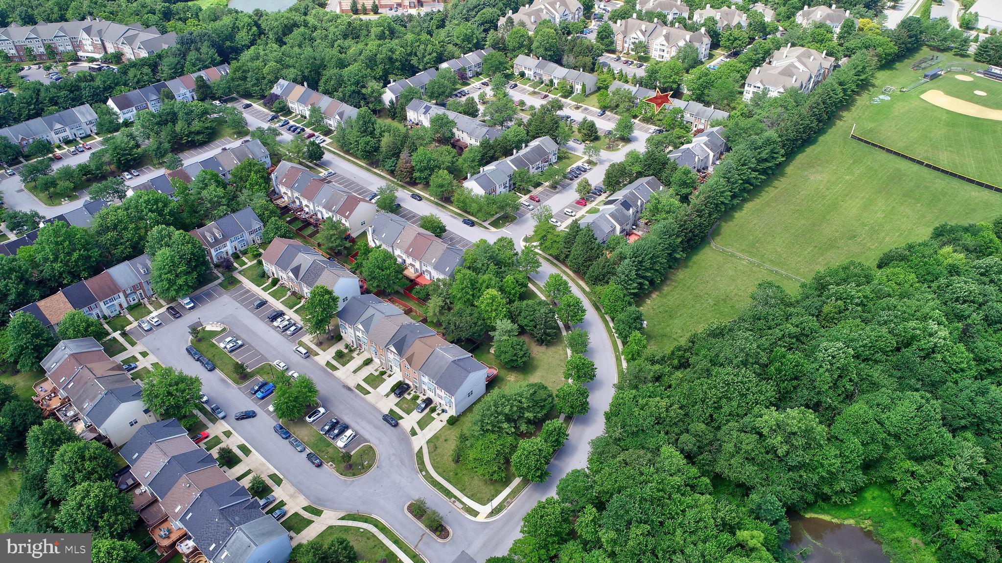 6136 Starburn Path Columbia, MD 21045 - Photo 31 of 35 an aerial view of residential houses with outdoor space and trees all around