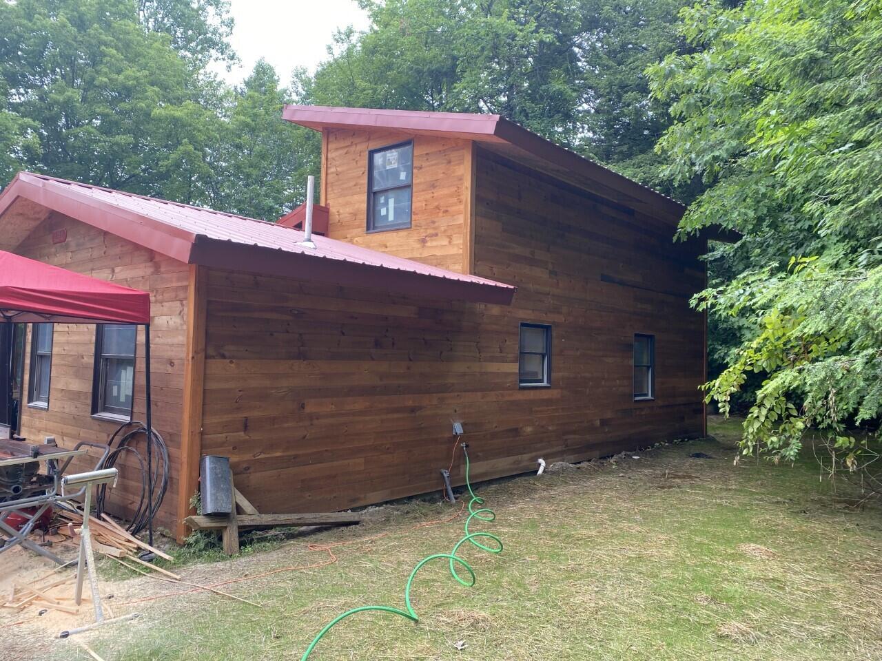 274 South Freedom Road Albion, ME 04910 - Photo 2 of 12 Side of house with new grass coming in