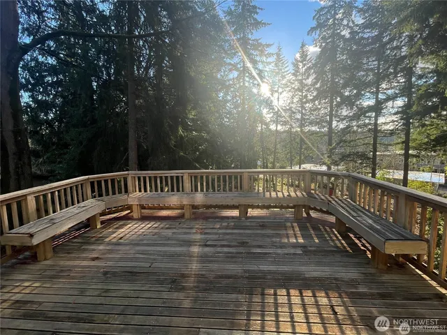 a view of deck with a large trees