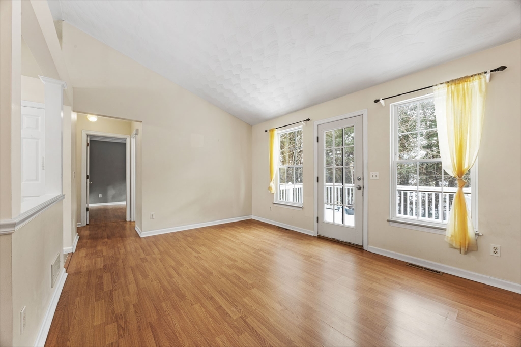 305 Raymond Road Plymouth, MA 02360 - Photo 12 of 29 wooden floor in an empty room with a window