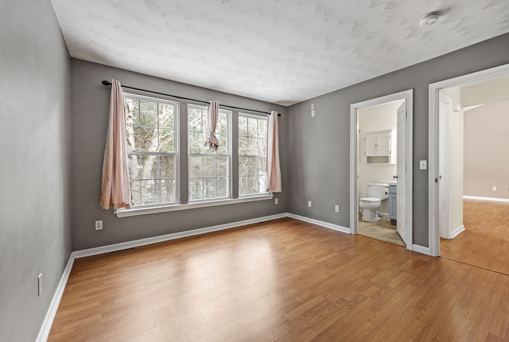 305 Raymond Road Plymouth, MA 02360 - Photo 13 of 29 a view of empty room with wooden floor and fan