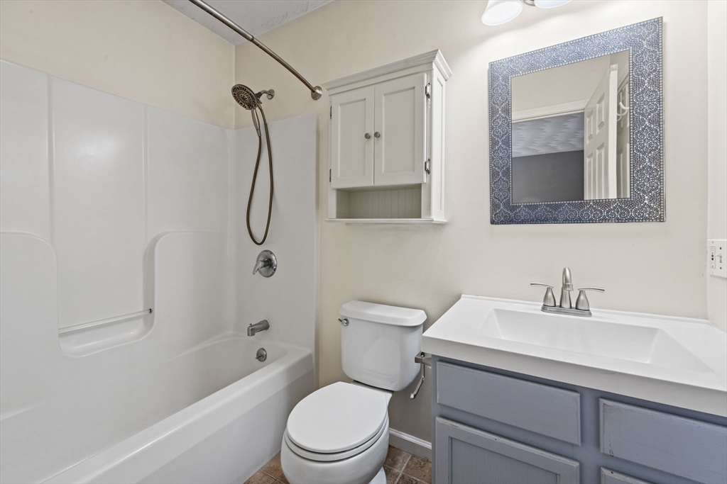 305 Raymond Road Plymouth, MA 02360 - Photo 22 of 29 a bathroom with a toilet sink shower and mirror