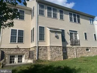 a view of a house with brick walls