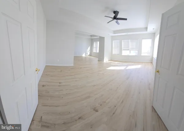a kitchen with a refrigerator sink and cabinets