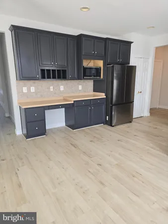 a view of a livingroom with wooden floor
