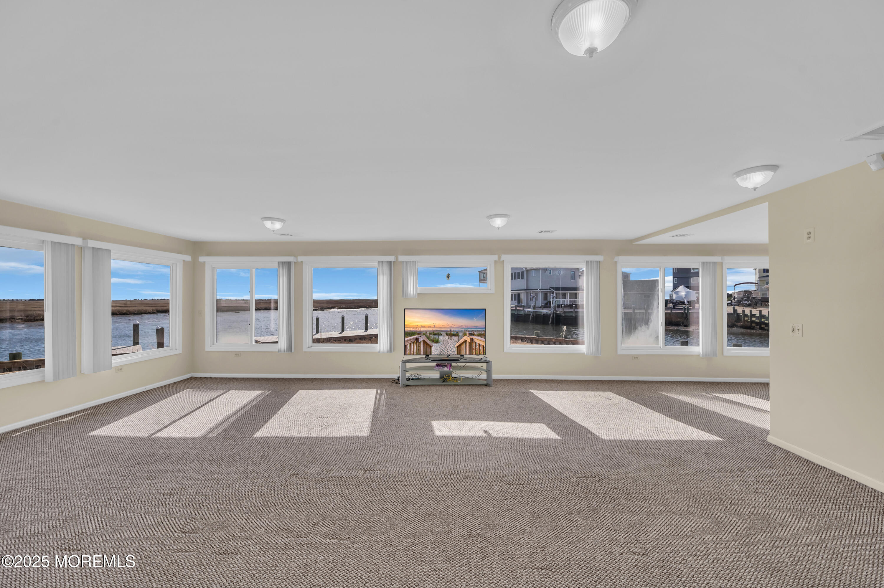 164 North Spinnaker Drive Little Egg Harbor, NJ 08087 - Photo 12 of 33 a living room with furniture and a large window