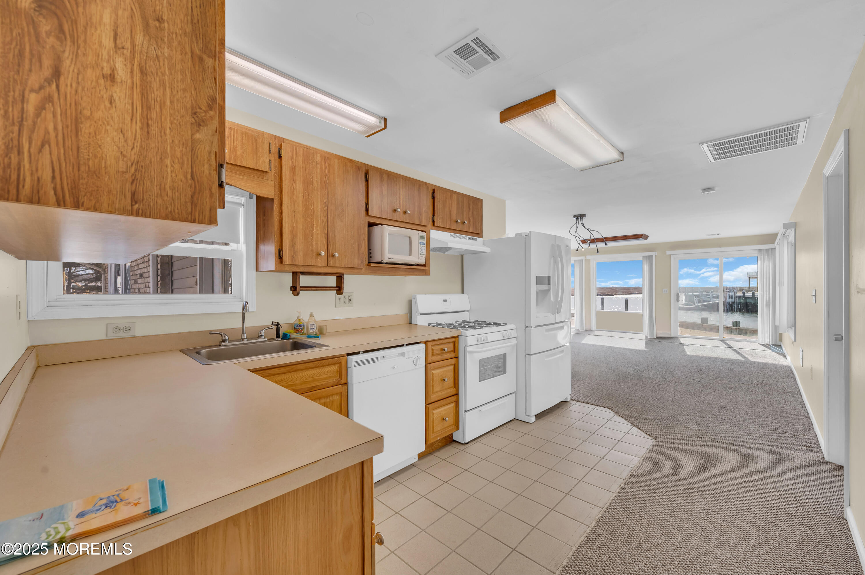164 North Spinnaker Drive Little Egg Harbor, NJ 08087 - Photo 14 of 33 a kitchen with a sink stove and refrigerator