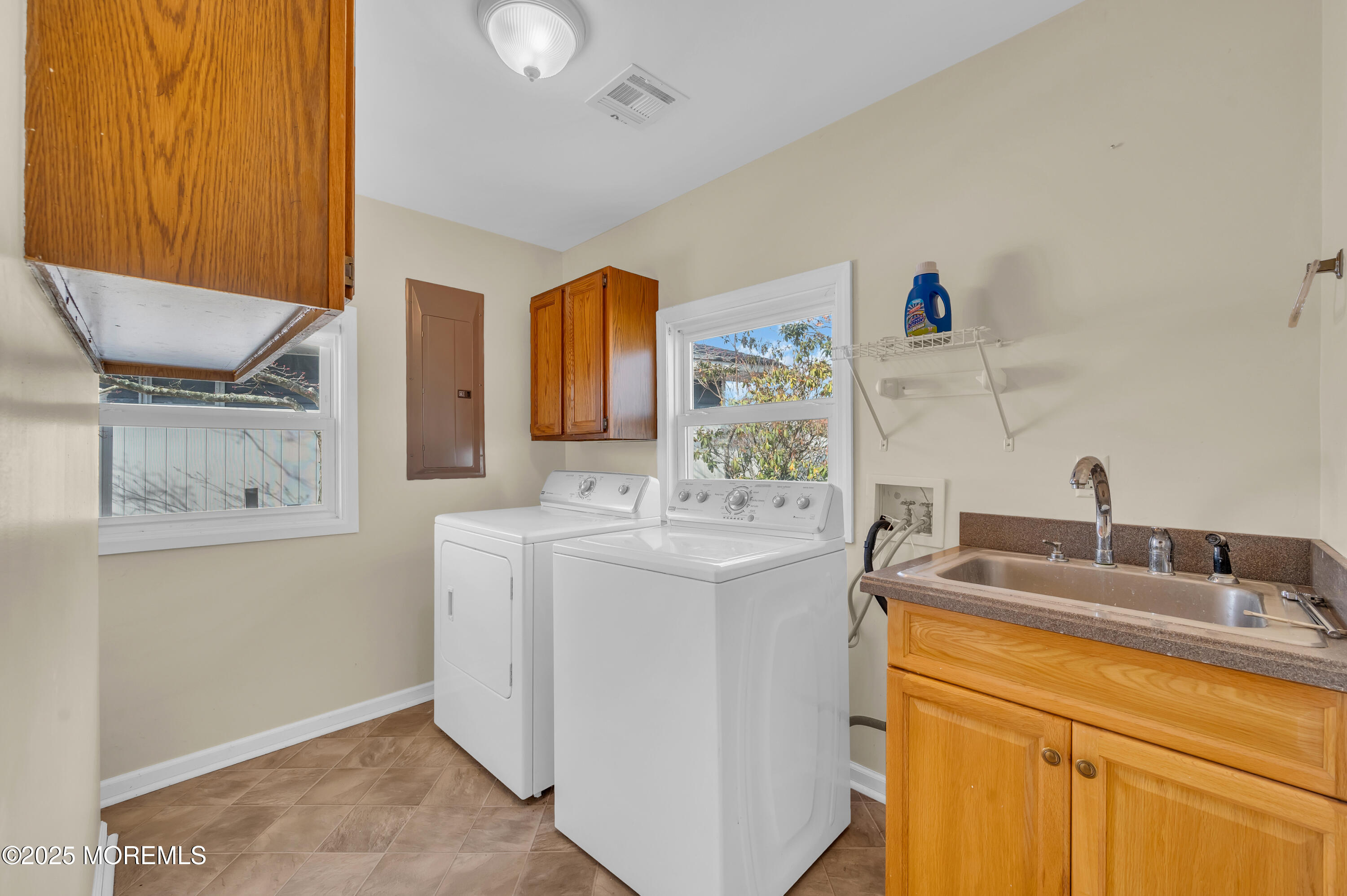 164 North Spinnaker Drive Little Egg Harbor, NJ 08087 - Photo 16 of 33 a bathroom with a sink and a mirror