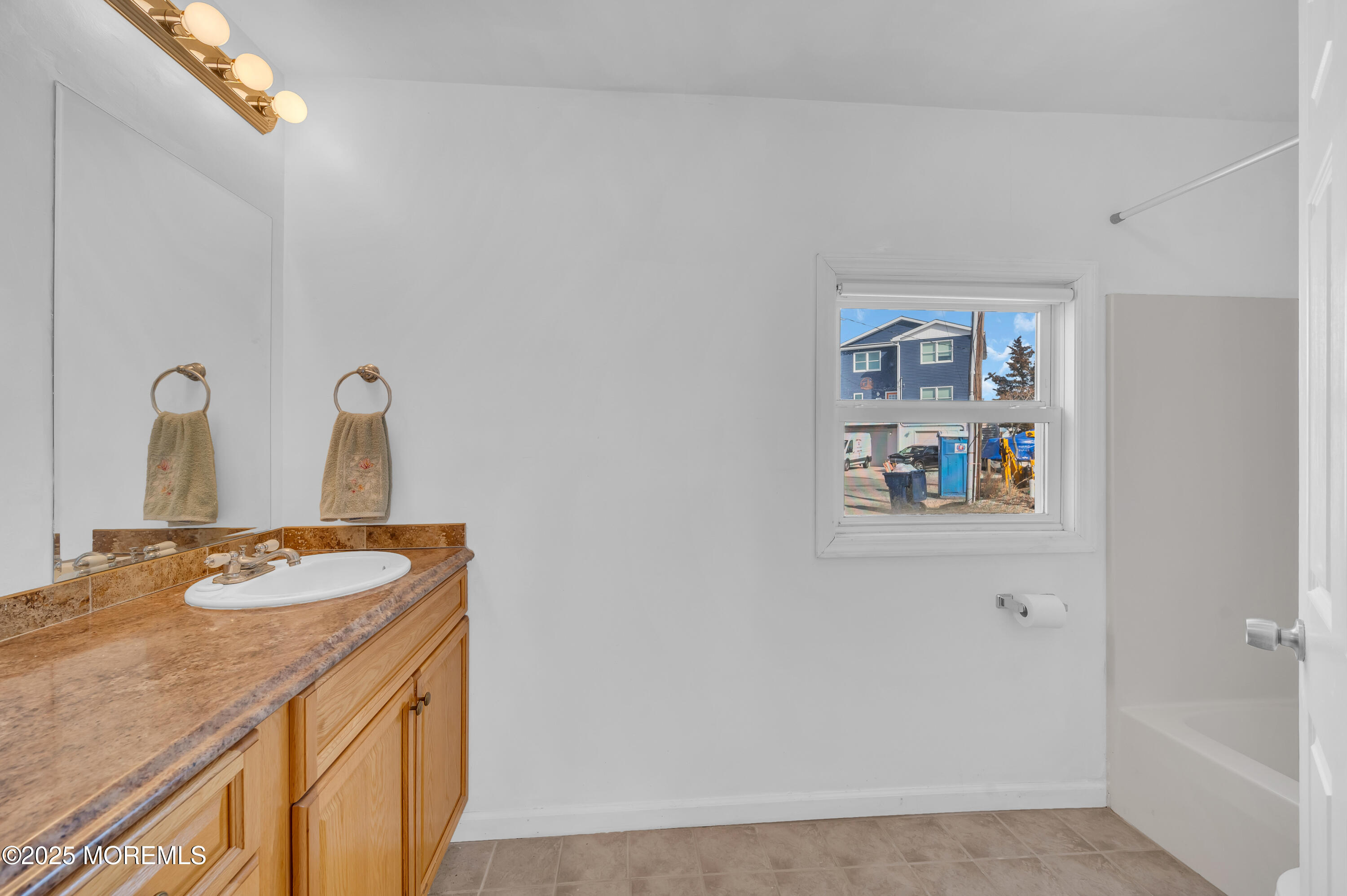 164 North Spinnaker Drive Little Egg Harbor, NJ 08087 - Photo 17 of 33 a bathroom with a sink and a mirror