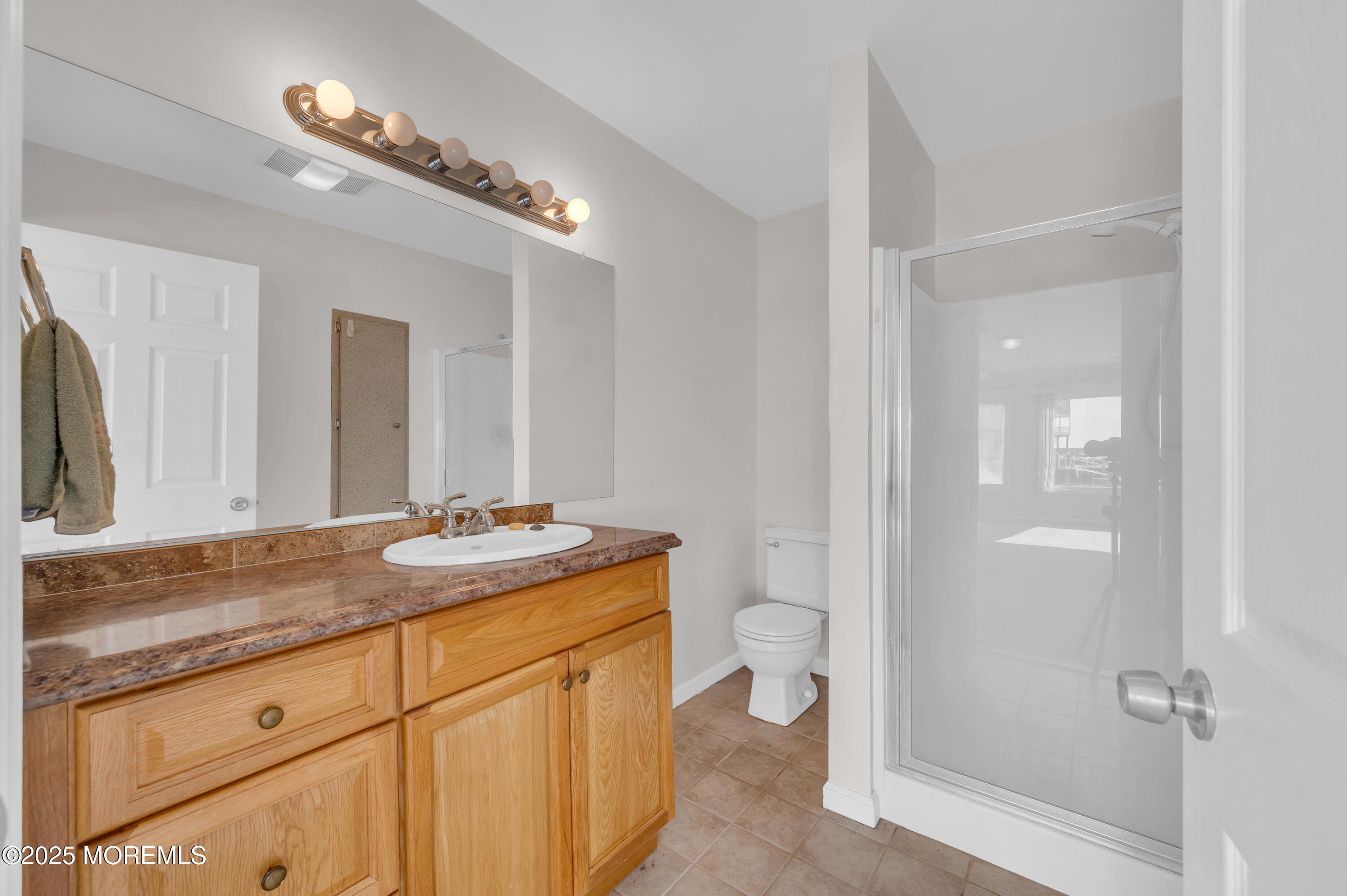 164 North Spinnaker Drive Little Egg Harbor, NJ 08087 - Photo 18 of 33 a bathroom with a granite countertop sink a mirror and a shower