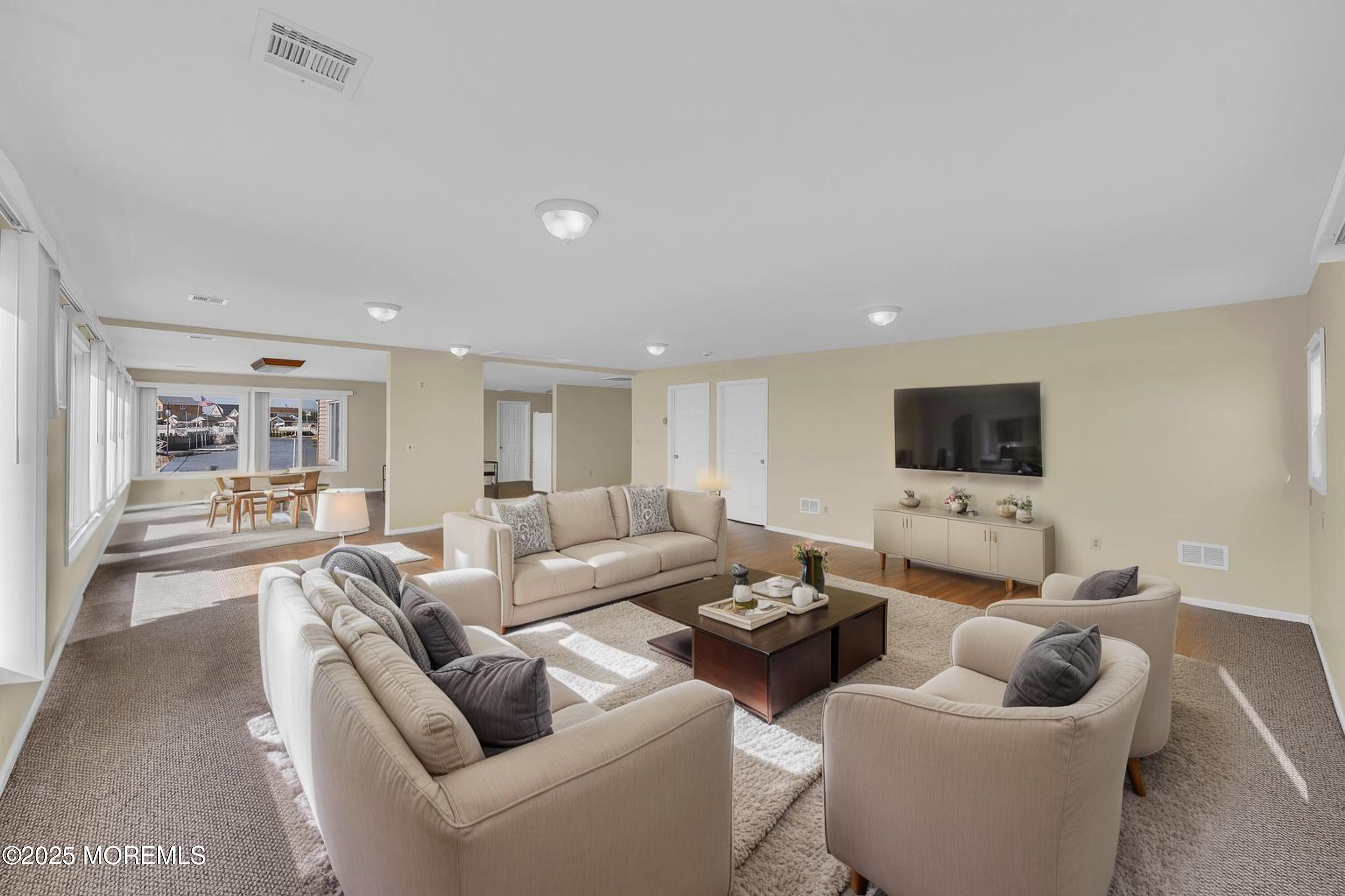 164 North Spinnaker Drive Little Egg Harbor, NJ 08087 - Photo 24 of 33 a living room with furniture and a flat screen tv