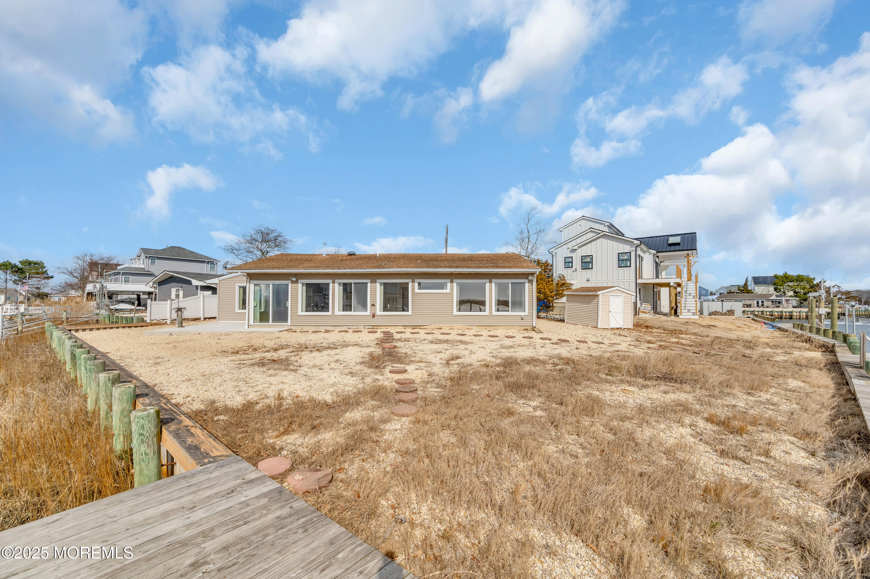 164 North Spinnaker Drive Little Egg Harbor, NJ 08087 - Photo 27 of 33 a view of a house next to a yard