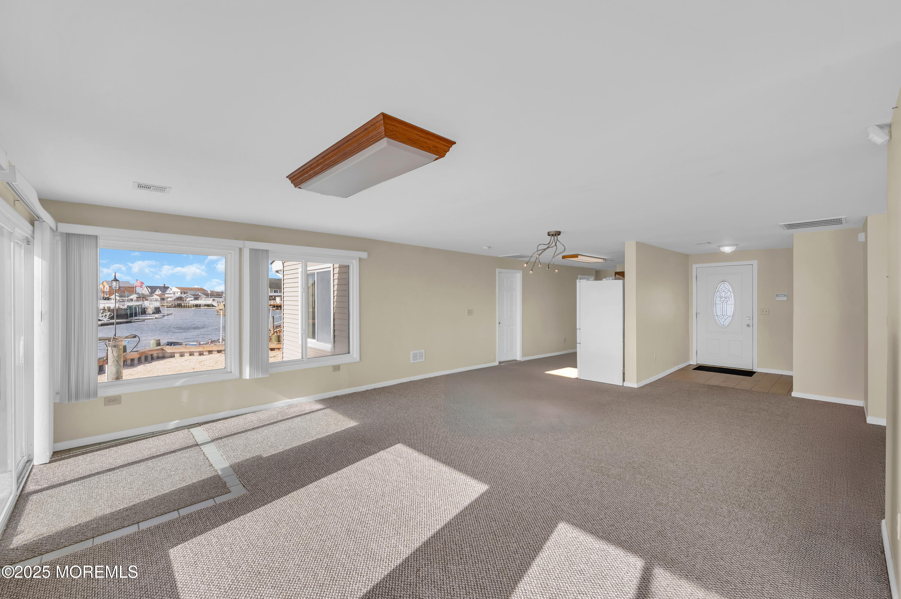 164 North Spinnaker Drive Little Egg Harbor, NJ 08087 - Photo 7 of 33 an empty room with windows and cabinet