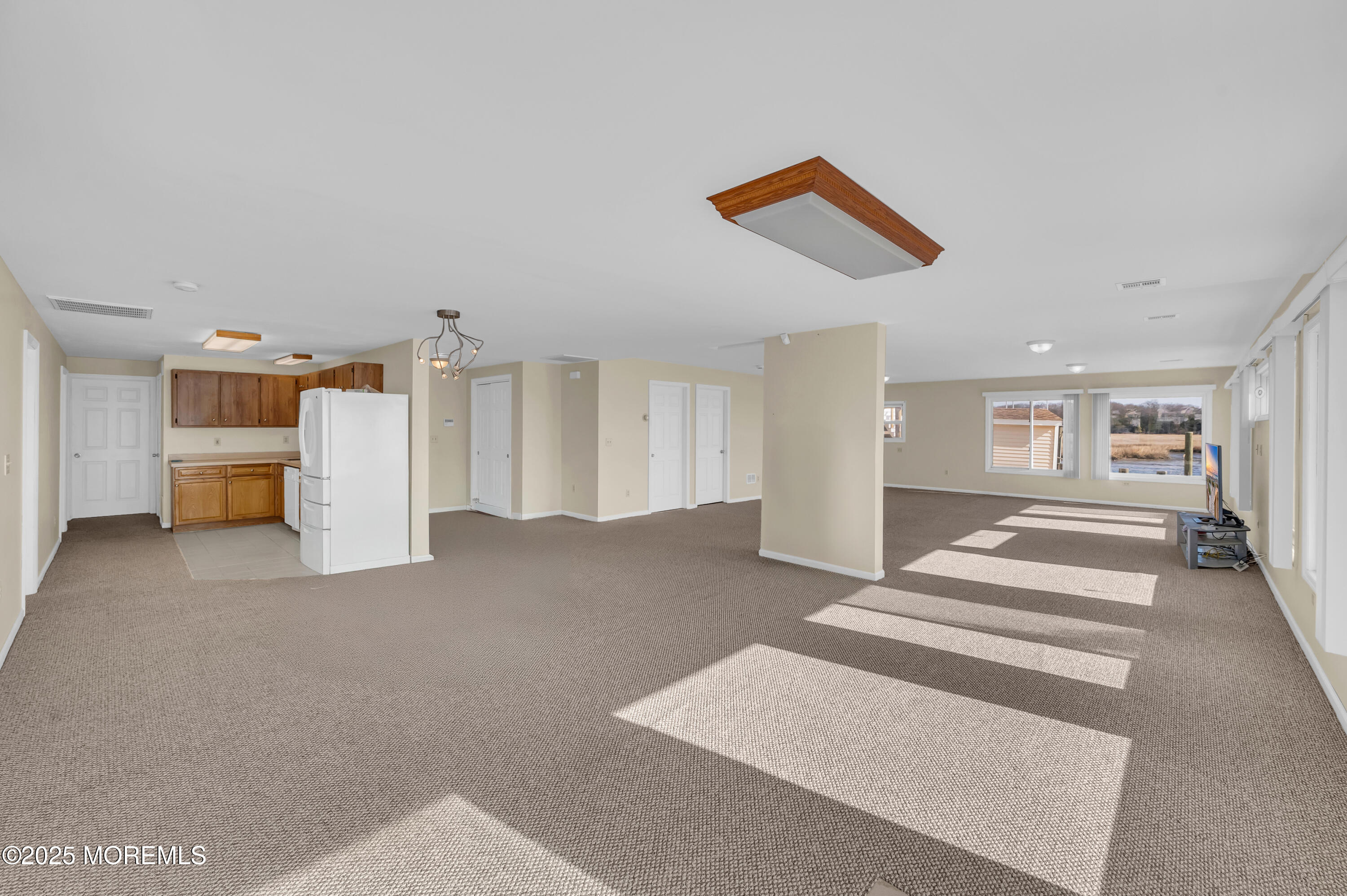 164 North Spinnaker Drive Little Egg Harbor, NJ 08087 - Photo 8 of 33 a view of a livingroom with a furniture and a ceiling fan