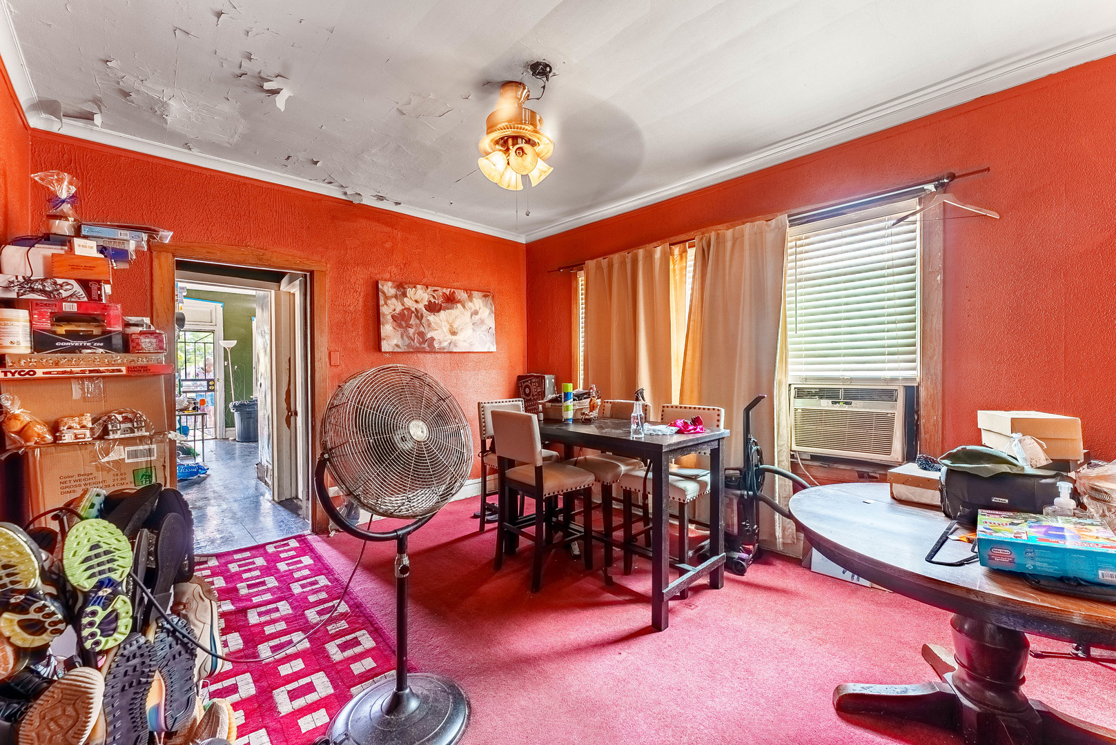 7149 South Wood Street Chicago, IL 60636 - Photo 17 of 26 a living room with furniture a rug and a chandelier