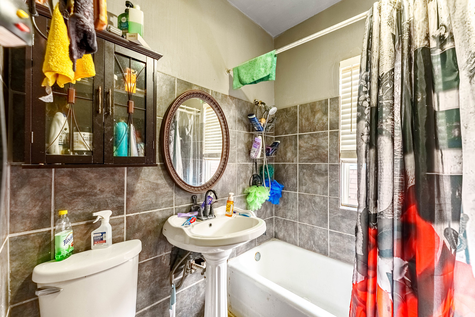 7149 South Wood Street Chicago, IL 60636 - Photo 19 of 26 a bathroom with a sink toilet and shower