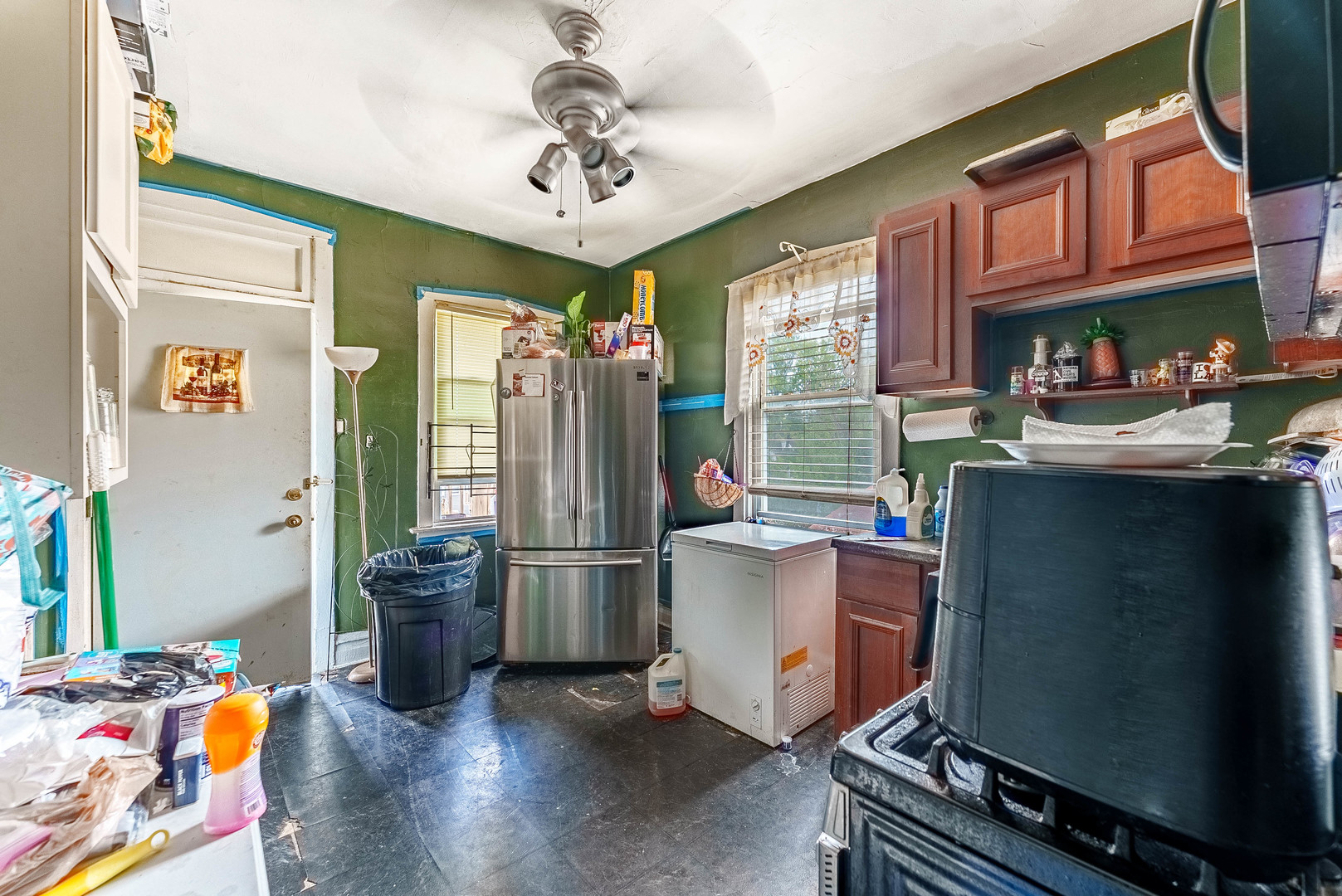 7149 South Wood Street Chicago, IL 60636 - Photo 21 of 26 a room with stainless steel appliances granite countertop a stove and a refrigerator