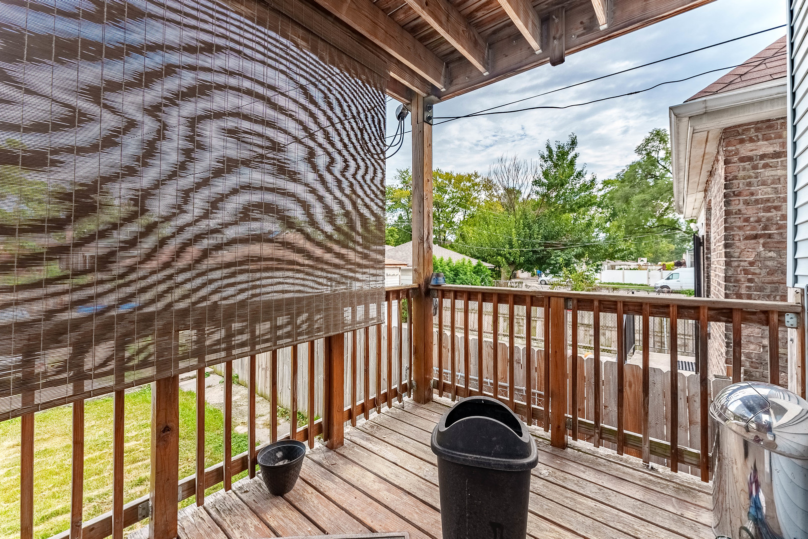 7149 South Wood Street Chicago, IL 60636 - Photo 24 of 26 a balcony with couch and wooden floor