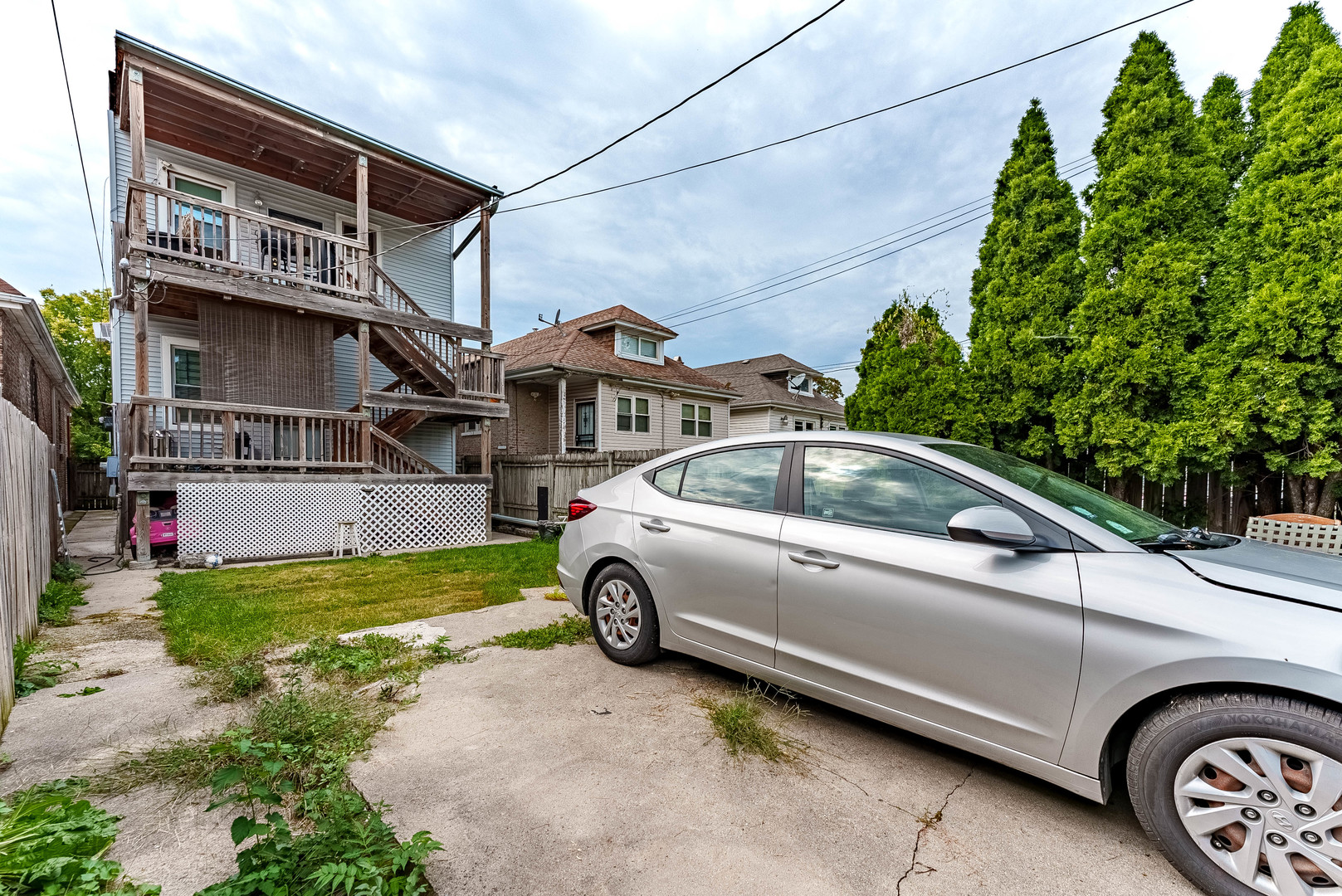 7149 South Wood Street Chicago, IL 60636 - Photo 26 of 26 a front view of a house with parking space