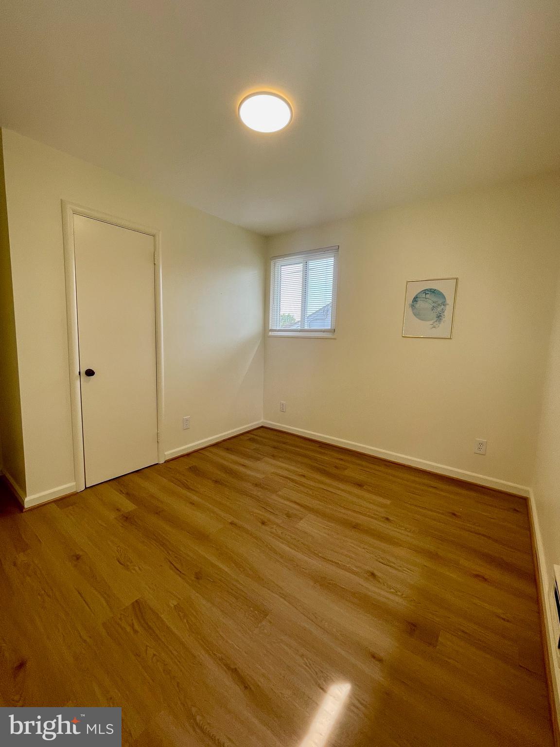 12505 Feldon Street Silver Spring, MD 20906 - Photo 13 of 32 a view of empty room with wooden floor