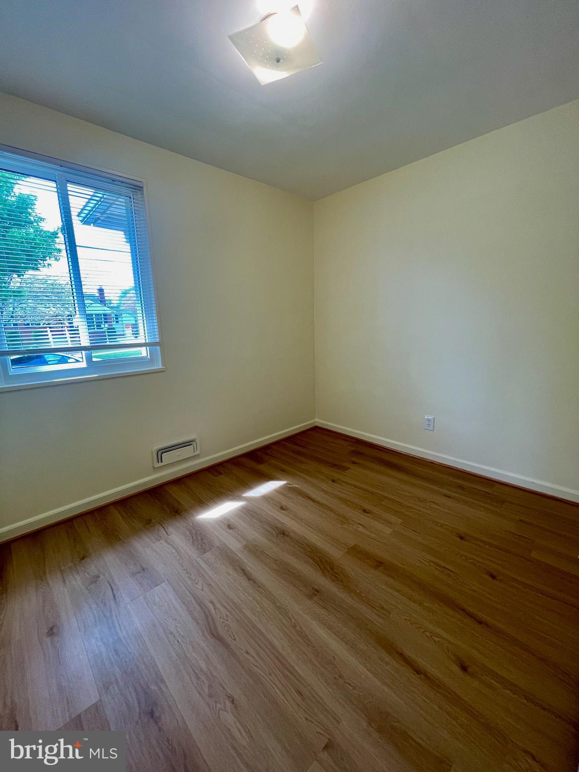12505 Feldon Street Silver Spring, MD 20906 - Photo 14 of 32 wooden floor in an empty room