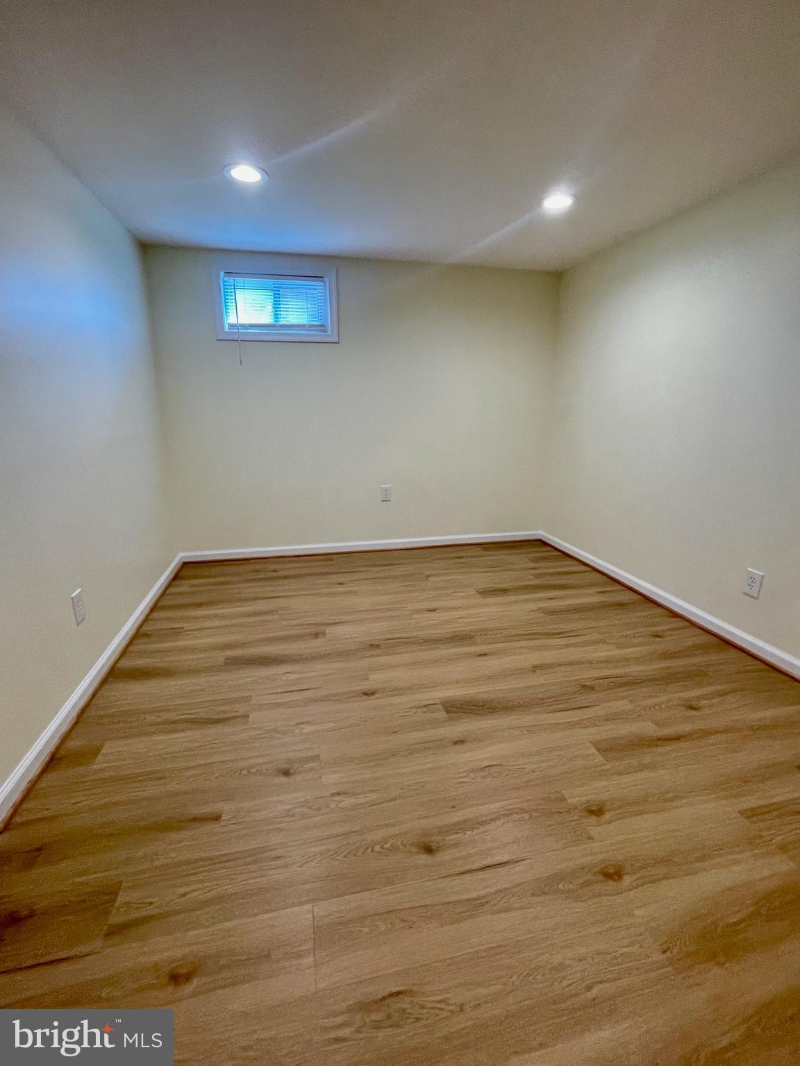 12505 Feldon Street Silver Spring, MD 20906 - Photo 16 of 32 a view of an empty room with wooden floor