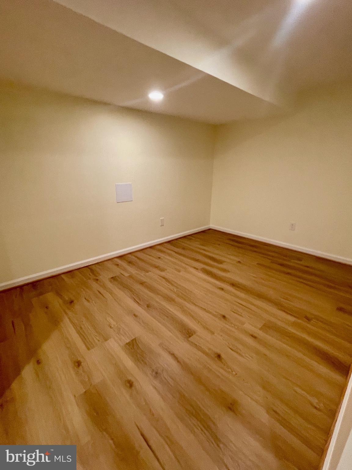 12505 Feldon Street Silver Spring, MD 20906 - Photo 19 of 32 a view of empty room with wooden floor