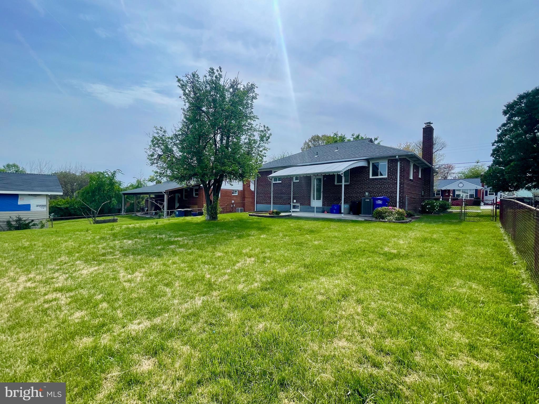 12505 Feldon Street Silver Spring, MD 20906 - Photo 25 of 32 a view of a house with a big yard and large trees