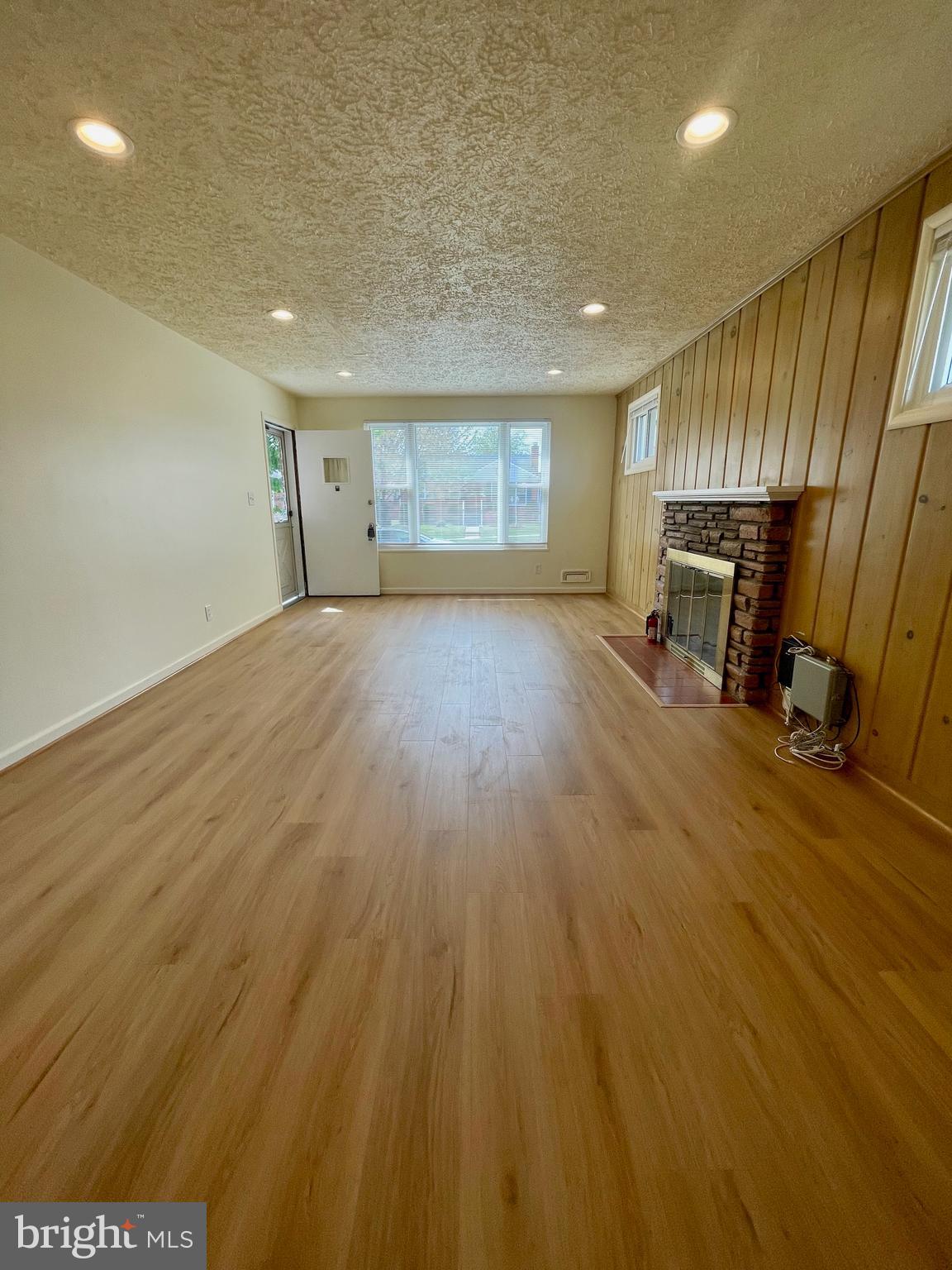 12505 Feldon Street Silver Spring, MD 20906 - Photo 7 of 32 a view of empty room with wooden floor and fan