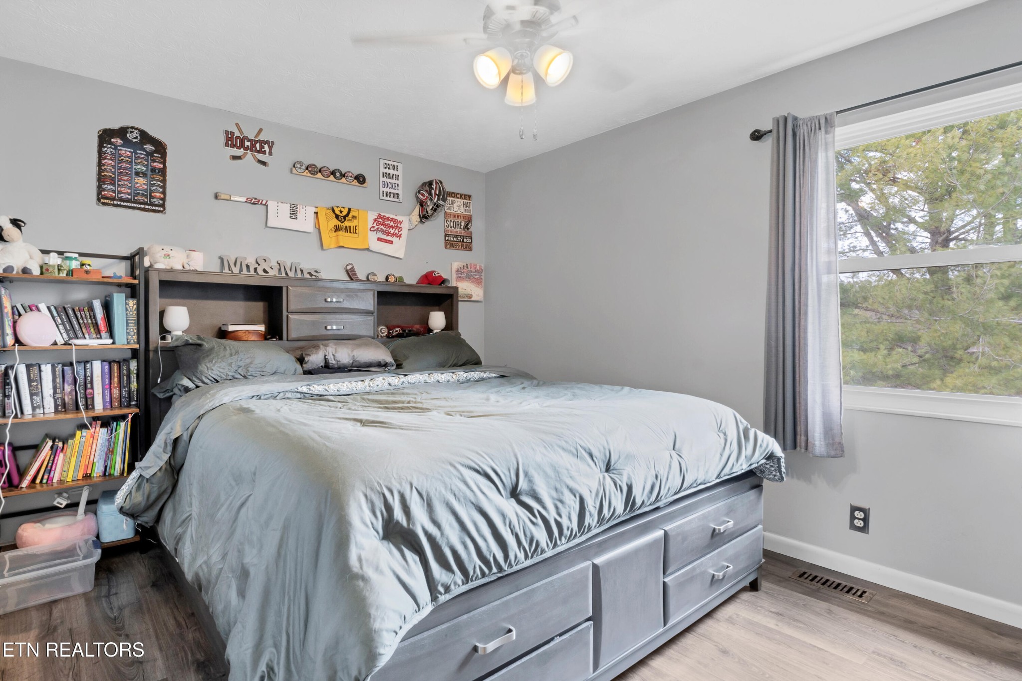 926 Amy Street Seymour, TN 37865 - Photo 11 of 22 a bed sitting in a bedroom next to a window