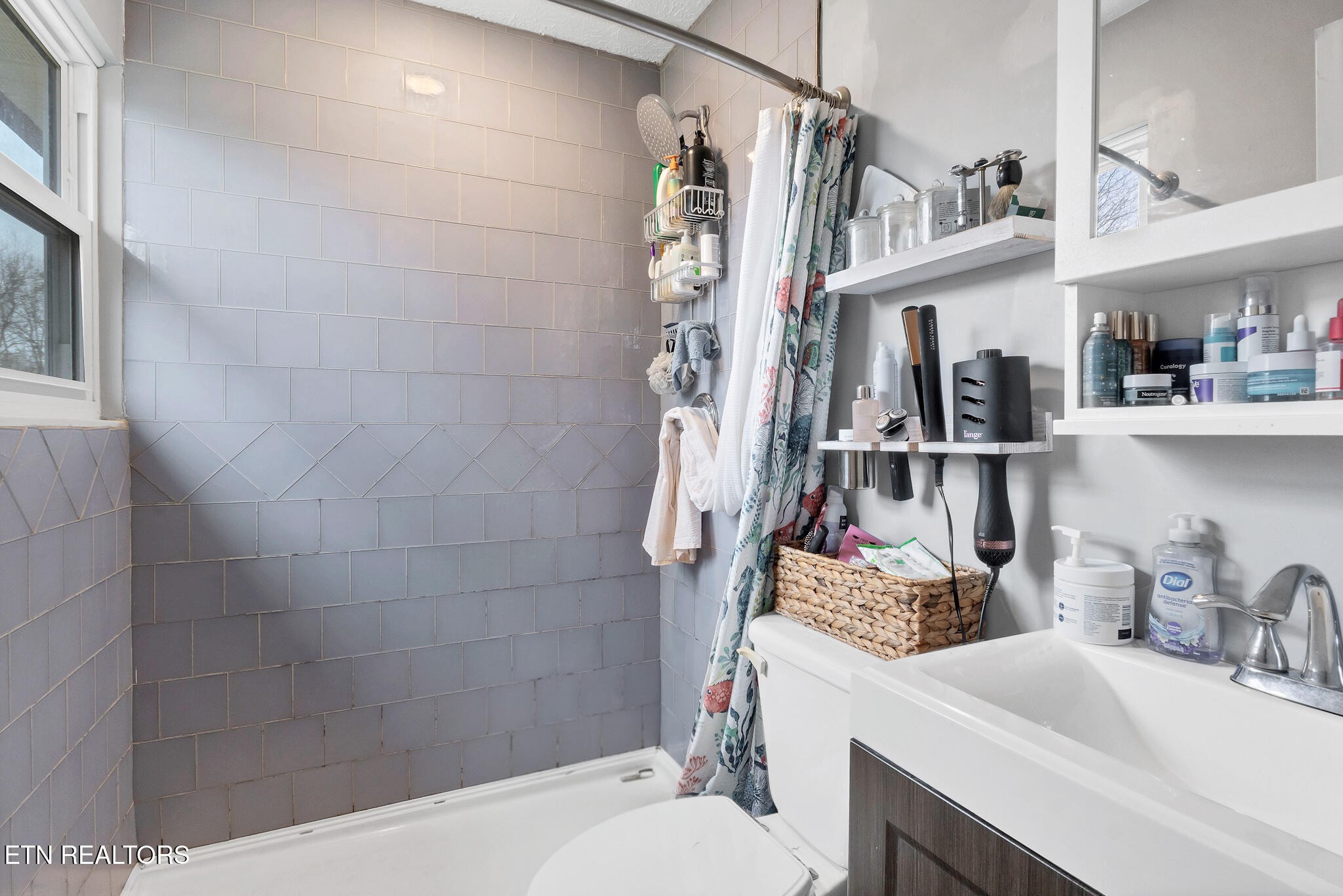 926 Amy Street Seymour, TN 37865 - Photo 13 of 22 a bathroom with a sink toilet and shower
