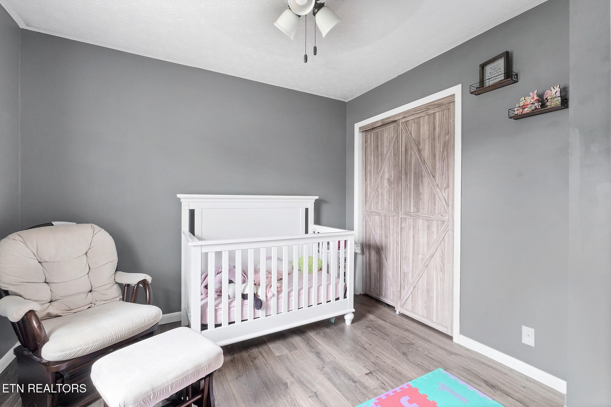 926 Amy Street Seymour, TN 37865 - Photo 15 of 22 a bedroom with a bed and a couch