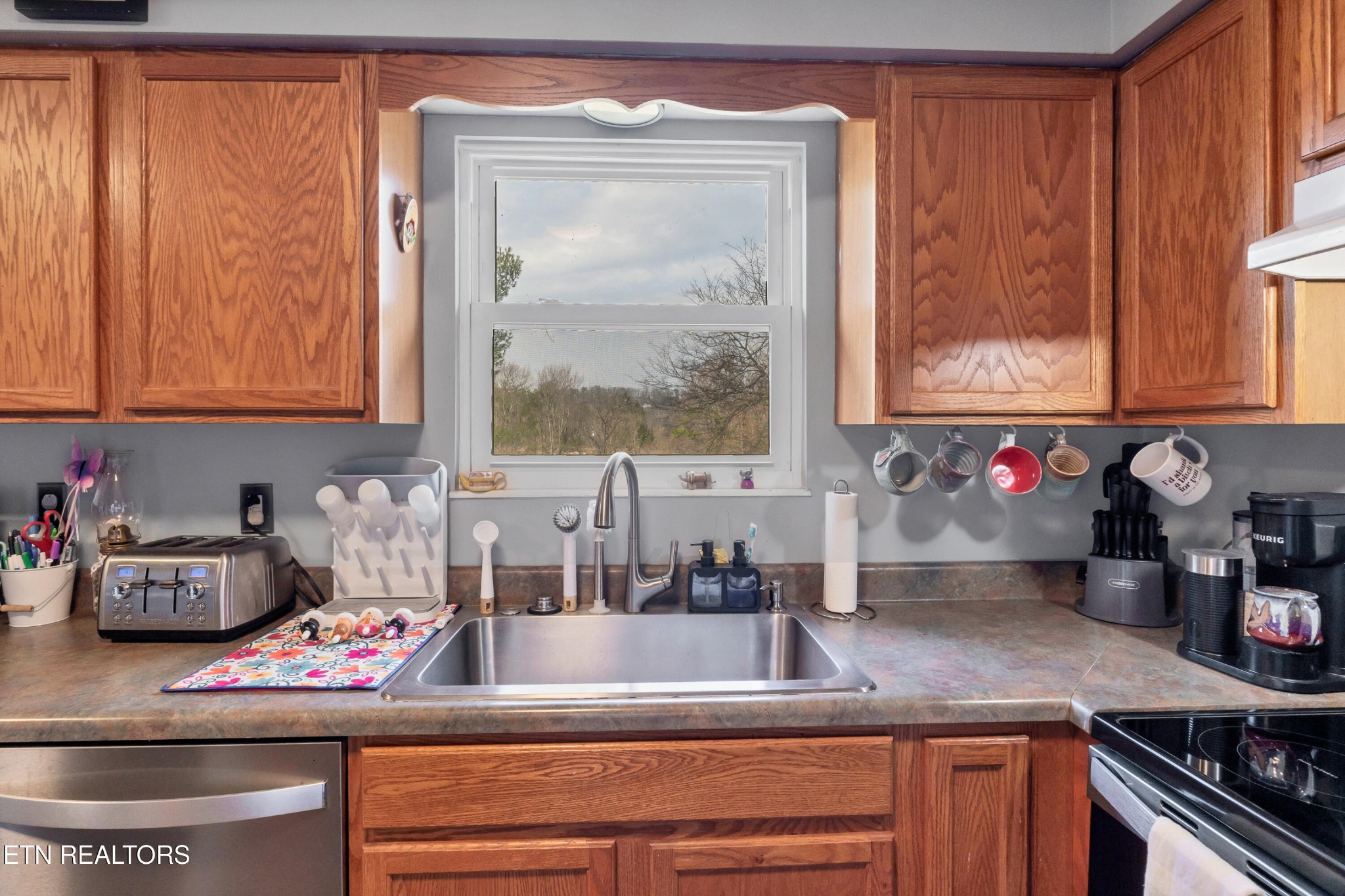 926 Amy Street Seymour, TN 37865 - Photo 9 of 22 a kitchen with a sink and a stove top oven