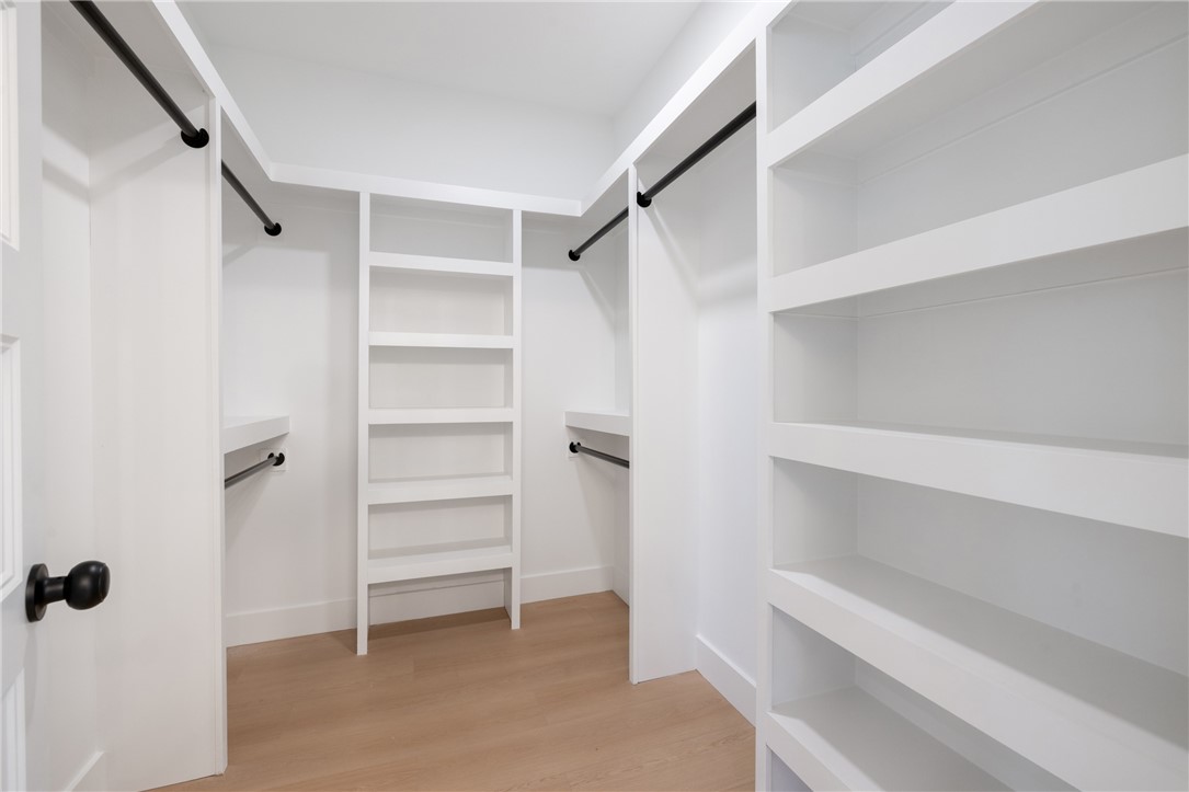 322 Oconee Avenue Westminster, SC 29693 - Photo 16 of 43 This spacious walk-in closet offers ample storage with custom shelving and hanging rods.