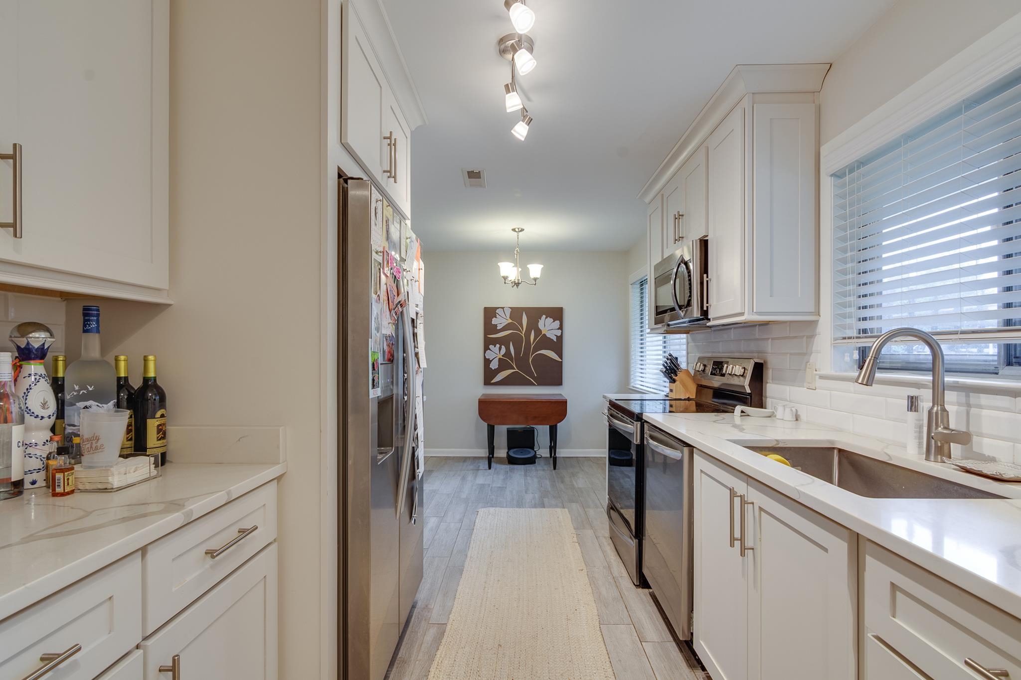 4563 Aldersgate Road Memphis, TN 38117 - Photo 11 of 22 a kitchen with a sink and cabinets