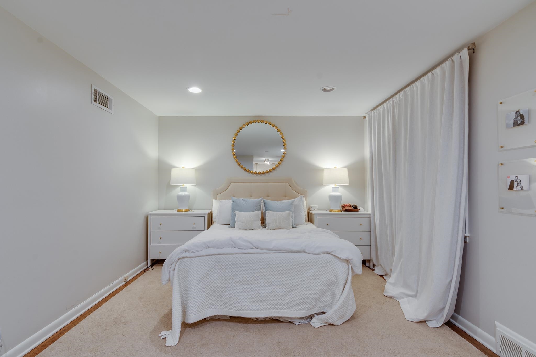 4563 Aldersgate Road Memphis, TN 38117 - Photo 17 of 22 a bed room with a bed mirror and a window