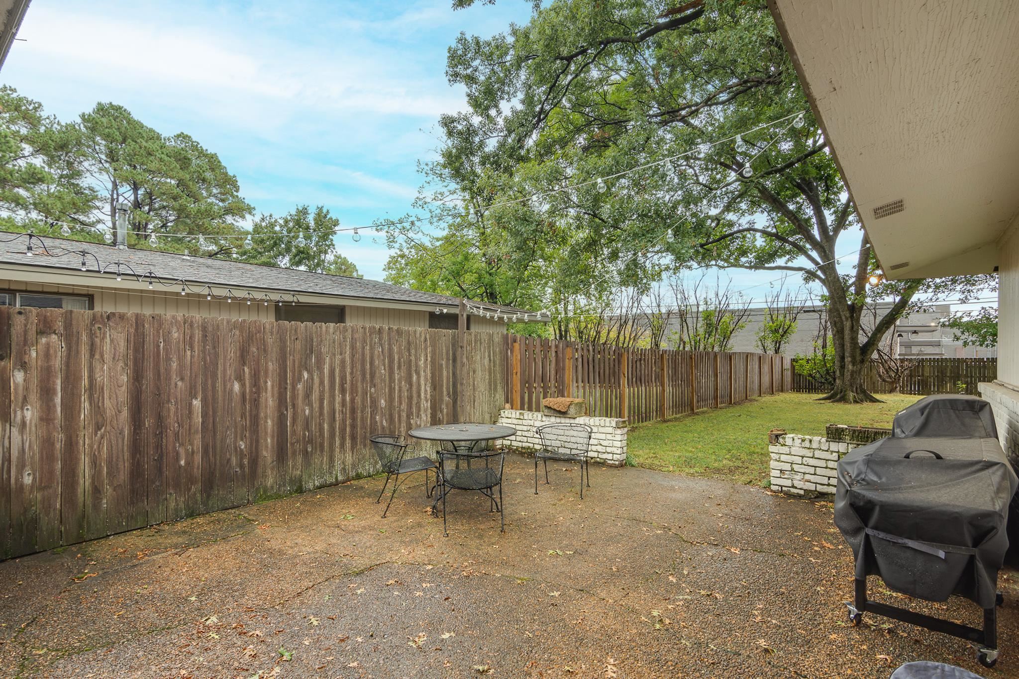 4563 Aldersgate Road Memphis, TN 38117 - Photo 20 of 22 a view of a backyard with chairs and a backyard