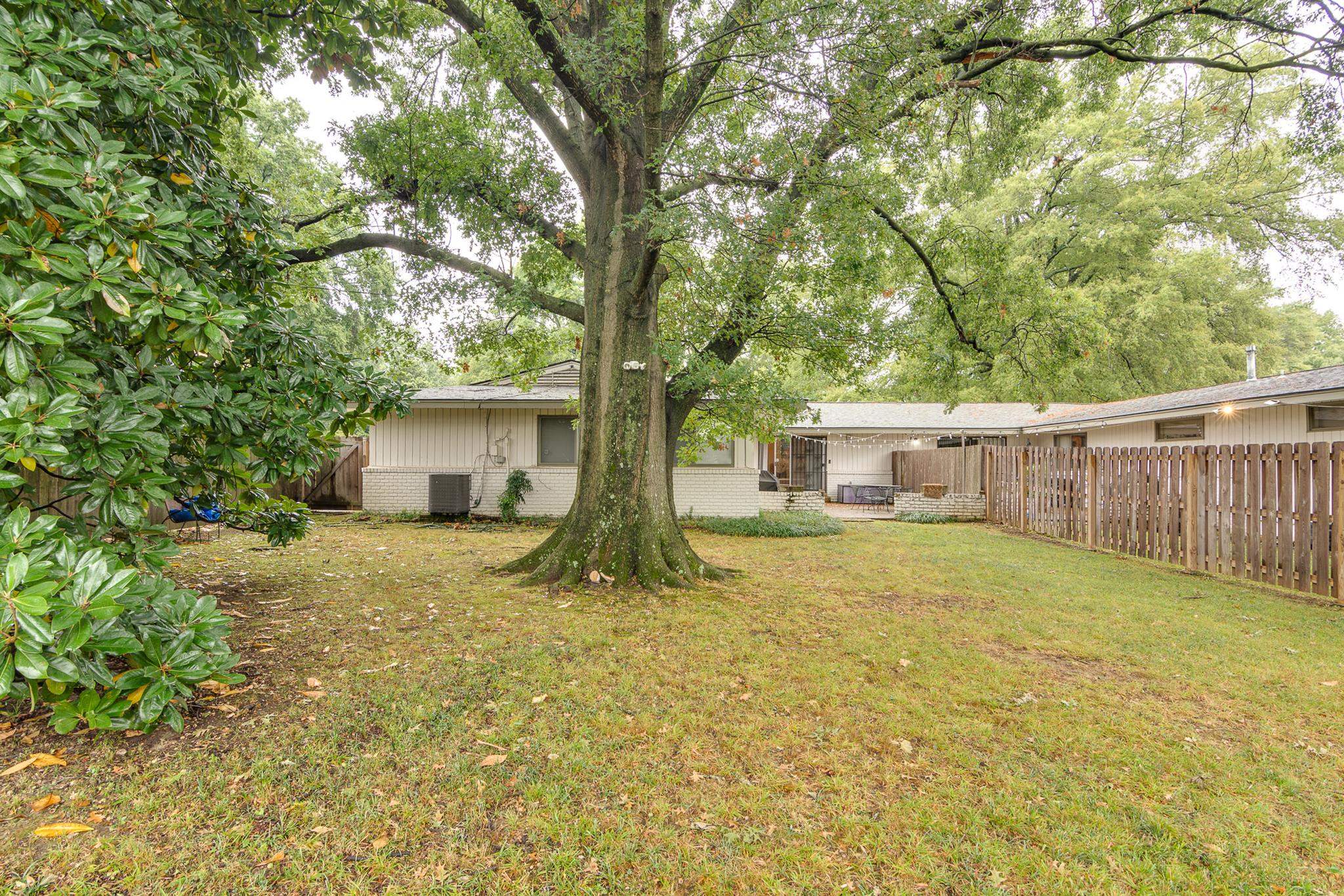 4563 Aldersgate Road Memphis, TN 38117 - Photo 22 of 22 a view of a house with a yard and large tree