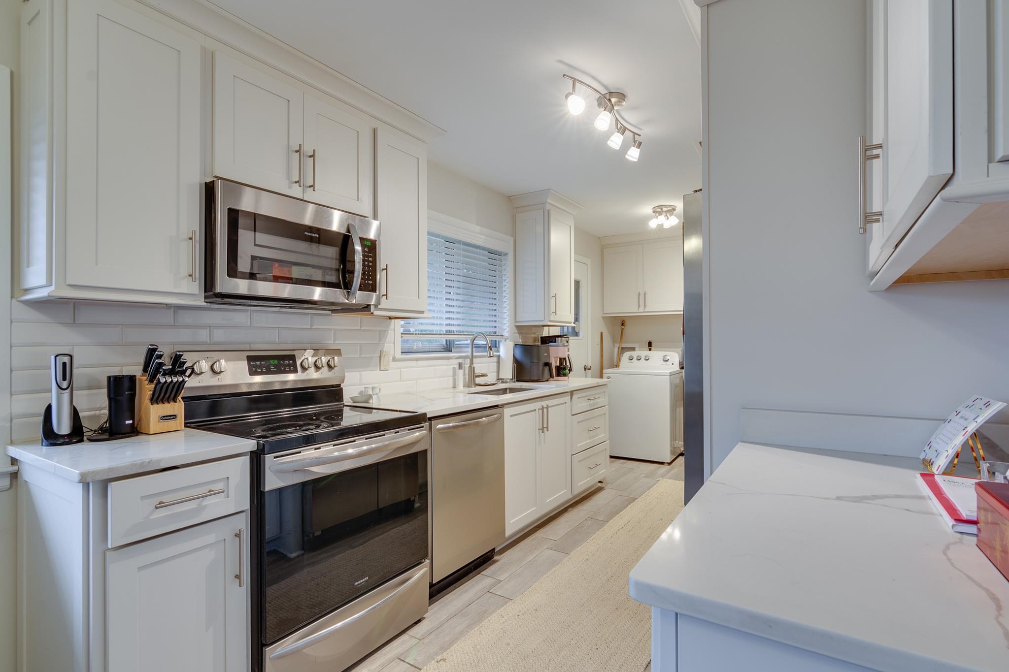 4563 Aldersgate Road Memphis, TN 38117 - Photo 9 of 22 a kitchen with a sink stove and microwave