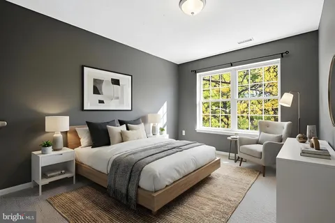 a view of an empty room with closet area