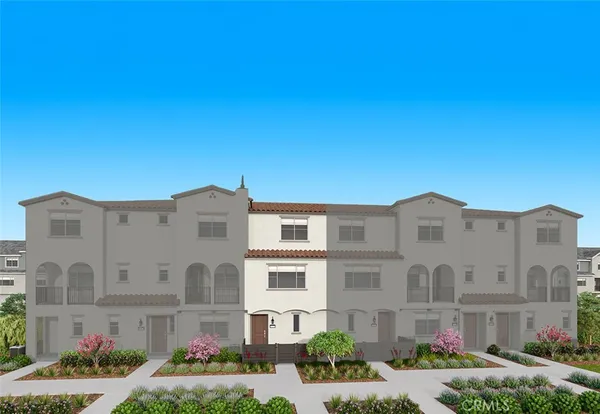 a front view of a building with cars parked