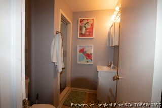 302 North 13th Street Erwin, NC 28339 - Photo 12 of 20 a bathroom with a shower and a sink