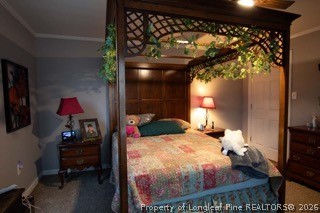 302 North 13th Street Erwin, NC 28339 - Photo 17 of 20 a bedroom with a bed and a window