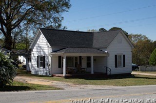 302 North 13th Street Erwin, NC 28339 - Photo 3 of 20 a view of a house with a garden