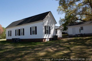 302 North 13th Street Erwin, NC 28339 - Photo 5 of 20 a front view of a house with a yard