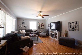 302 North 13th Street Erwin, NC 28339 - Photo 9 of 20 a living room with furniture a flat screen tv and a large window