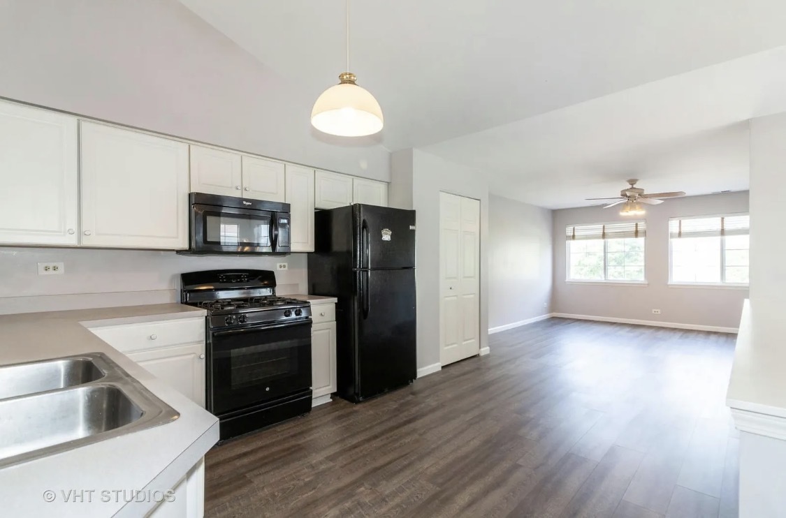 1069 Ripple Ridge Darien, IL 60561 - Photo 4 of 12 a kitchen with granite countertop a refrigerator stove and sink